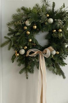 a christmas wreath hanging on the wall