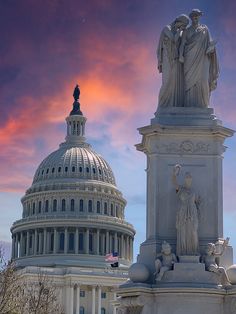 the capitol building with statues on top