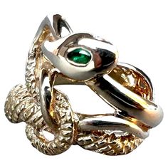 Emerald White Diamond Ruby Eyes Snake Ring Victorian Style J Dauphin J DAUPHIN "Eternal Renewal" made in bronze inspired by the Victorian age Hand made in Los Angeles The serpent, or snake, is one of the oldest and most widespread mythological symbols. Historically, serpents and snakes represent fertility or a creative life force. As snakes shed their skin through sloughing, they are symbols of rebirth, transformation, immortality, and healing. The ouroboros, the snake forever swallowing its own Luxury Antique Style Snake Ring As Gift, Victorian Snake Ring, Luxury Vintage Hallmarked Snake Ring, Gold Snake Ring With 17 Jewels, Fine Jewelry, Luxury Vintage Snake-shaped Jewelry, Snake Shedding, Alchemic Symbols, United Arrows, Harvey Nichols