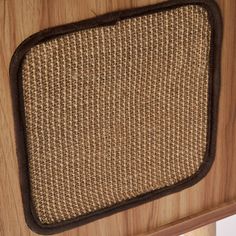 a close up of a wooden cabinet with a brown and black trim on the front