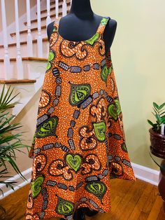 "This beautiful Summer Dress, Bright Colors, Free size Dress made with African Wax Fabric. This dress can be worn as casual outfit or formal with accessories like obi belt and other accessories. 100% Wax Cotton Fabric **Size: One size Fits Most MODEL'S HIEGHT IS 5' 7\" Dress Length: 40 inches Dress has two side pockets Matching Earring also available For more information please contact me. Thanks for visiting our shop" Casual Orange A-line Sundress, Casual Orange A-line Maxi Dress, Bohemian Orange A-line Dress, Orange Bohemian A-line Dress, Free Size Dress, Boho Head Wrap, Dress African Print, Dress Ankara, Beautiful Summer Dresses