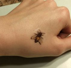 a small tattoo on the wrist of a person