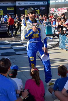 a man standing on top of a race track