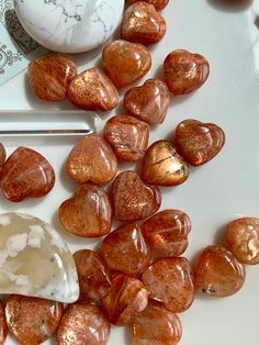 Bring some glittery golden Sunstone Hearts into your sacred space + feel the joyful + good natured energy radiate into the room. Allow these sparkly, silvery, peachy orange mini Sunstone Heart shapes to inspire you to blossom into your full potential. The Grade A Mini Sunstone hearts are super high quality, glossy, with glittery confetti, gorgeous coloring + loads of sparkles. Some even have a little sparkly lattice lines visible in the stone. The Grade B are cut from the same stock but have min Reading Journals, Hope Light, Moon Rituals, Shaped Crystals, Peachy Orange, Crystal Grids