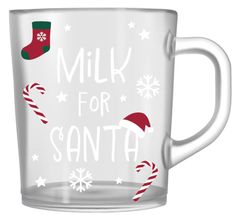 a glass mug with the words milk for santa on it