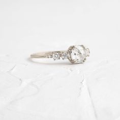 an engagement ring with three diamonds on it