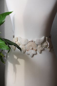 Haute couture wedding dress belt. Bridal belt was made using ivory seed beads and natural fresh water pearls. The technique of wedding belt is bead embroidery. Original wedding sash. Beaded waist belt is wide and adjustable. The belt volume is regulated on the sides. Bridal sash bet could be made perfect your size. Materials was used: Natural fresh water pearls ( cream and light gray colors ) two different sizes. Nine different shades of ivory color using seed beads. Acrylic round beads. Cords t Elegant Beaded Bridal Belt, Elegant Beaded Fitted Bridal Belt, Elegant Beaded Adjustable Bridal Belt, White Embroidered Belt For Party, Elegant Beaded Bridal Belt For Party, Adjustable Beaded Bridal Belt For Wedding, Elegant Bridal Belt With Sashes For Bride, Elegant Adjustable Bridal Belt, Elegant Pearl Embellished Bridal Belt For Wedding