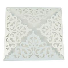 a white doily with an intricate design on it