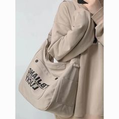 Product information: Style: Casual/Street/Preppy/Vintage/Hip PopOccasion: Weekend Casual/Going Out/Holiday/Travel/School Material: Oxford cloth Size: upper width 39. lower width 33. height 30. thickness 19CM; Weight 0.28kg. Portable vertical height 4. shoulder strap 110 shoulder strap size is the longestDescription:Outfit yourself in a style that's Casual. Street. Preppy. Vintage. or Hip Pop with this Oxford cloth Letters Large Canvas Crossbody Bag! Perfect for the Weekend. Going Out. Holidays. Travel. or School - this bag has a width of 39cm at its upper point. 33cm at its lower point. is 30cm high. and has a thickness of 19cm. With a weight of 0.28kg and a shoulder strap size of 110cm (longest size). you'll be ready for adventure in no time!