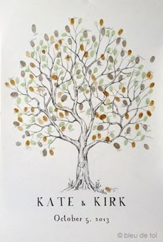 a wedding guest book with a tree on the front and leaves on the back cover