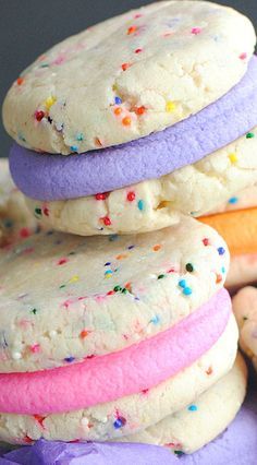 a stack of colorful cookies sitting on top of each other