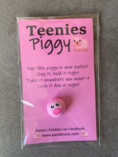 there is a pink piggy pin in the package