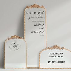 three personalized mirror decals are displayed in front of a white background with gold trim