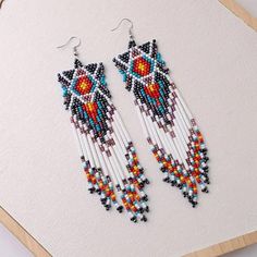 Nwot Beautiful Handmade Native Vintage Long Bead Tassel Boho Earrings. These Seed Bead Earrings Are Nice Gifts For Your Mother, Sister, Wife, Girlfriend, Colleagues, Classmates Or Other Female Friends. Fine Craftsmanship: These Tassel Beaded Earrings Are Well Crafted With Thousands Of Quality Seed Beads, These Colorful Earrings Will Not Lose Luster As Time Goes By, So You Can Fully Enjoy Them With Confidence. Easy To Match: These Statement Earrings Are Designed In The Popular Boho Tassel Style, White Fringe Tassel Earrings For Festivals, White Beaded Fringe Earrings For Festival, White Bohemian Beaded Dangle Earrings, Handmade White Bohemian Tassel Earrings, White Dangle Tassel Earrings For Festivals, White Bohemian Beaded Earrings With Dangling Beads, White Bohemian Beaded Dangling Earrings, Bohemian White Beaded Fringe Earrings, Bohemian White Tassel Earrings With Colorful Beads