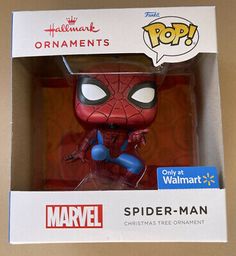 the spider - man pop vinyl figure is packaged in a box with an ornament on it