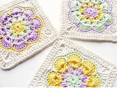 four crocheted squares are arranged in the shape of granny's squares