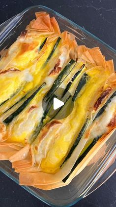 a casserole dish with asparagus and cheese