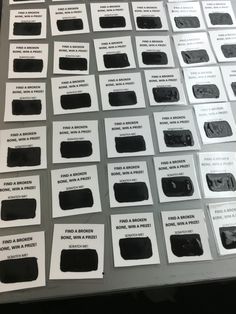 many different black and white labels on a table