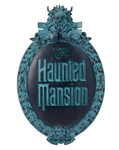 a sign that says,'haunted mansion'in blue and black with an ornate frame