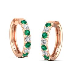 Expertly crafted from high-quality emeralds and diamonds, these stunning hoops offer a timeless and elegant look. The alternating design accentuates the beauty of both gemstones, adding a touch of sophistication to any outfit. Metal: 14K Gold Setting Type: Prong Rhodium Finish: Yes, on White Gold Gemstone Details: Gemstone: Emerald Shape: Round Average Dimensions: 3.30 MM Quantity: 08 Average Cut: Very Good Average Color: Medium to Dark Green Average Clarity: Eye Clean Natural Diamond Details: W Dance Jewelry, Birthstone Gifts, Ring Pendant Necklace, Diamond Hoop Earrings, Sparkle Diamonds, Mens Wedding Bands, Bridal Rings, Pendant Earrings, Wedding Men