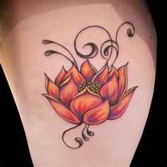 a woman's leg with a flower tattoo on it