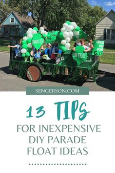 a parade float with balloons and people riding in it