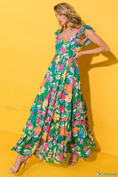 OrcaJump - Chic Sleeveless Maxi Dress with Green Floral Print and Ruffle Tier Detailing Floor-length Multicolor Maxi Dress With Vibrant Print, Multicolor V-neck Maxi Dress With Ruffle Hem, Tropical V-neck Maxi Dress With Vibrant Print, Tropical Multicolor Maxi Length Cover-up, Backless Dresses, Multicolor Floral Print Maxi Cover-up, Green Floral Print, Bohemian Print, Floral Color