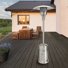 a patio heater sitting on top of a wooden deck