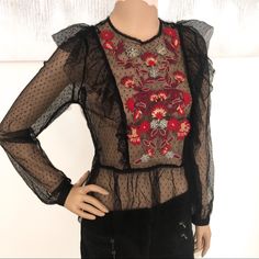 Sexy Black Mesh Top By Guess Has Polka Dots, Ruffles, & Colorful Embroidery. Long Sleeves & Gathered Waist. Buttons At The Back Of The Neck. Size Small. Underarm To Underarm It’s 17 Inches Across. Total Length Is 23 Inches. This Is Sheer & Would Look Good With A Black Sports Bra Tank Underneath. Flawless. But With Confidence; I’m A Posh Ambassador, Top-Rated Seller, & Fast Shipper. Glamorous Fitted Embroidered Blouse, Black Festive Blouse For Spring, Chic Black Tops With Floral Embroidery, Black Festive Tops For Summer, Black Tops With Floral Embroidery For Night Out, Black Top With Floral Embroidery For Night Out, Chic Embroidered Tops For Night Out, Black Summer Festive Blouse, Black Floral Embroidery Tops For Evening