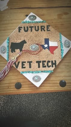 a graduation cap with the words, future vet tech on it and a dog's tail