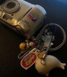 a camera and keychain on a table