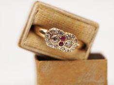 This elegant yellow gold diamond and ruby cluster ring has old cut gemstones. Features fourteen small diamonds, two big diamonds and in the centre and two rubies. All the gemstones have an exceptional spark and make the ring to stand out.  Victorian jewellery was produced during the reign of Queen Victoria, whose reign lasted from 1837 to 1901. Queen Victoria was an influential figure who established the different trends in Victorian jewellery. The amount of jewellery acquired throughout the Victorian era established a person's identity and status. The Victorian Jewelry even today is so unique and always stands out. Hallmarks: Inside the shank you will find the 18ct stamp that indicates the karats of the gold and the W.BROS that is the makers stamp. Condition: Overall in excellent antique Engagement Ring Victorian, Victorian Gold Ring, Victorian Engagement Ring, Big Diamonds, Victorian Diamond Ring, Victorian Jewellery, The Ring Face, Victorian Engagement Rings, Big Diamond