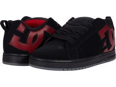 DC Court Graffik - Men's Skate Shoes : Black/Red Print : A modern classic, stay true to form with the bold logo detail and reliable comfort of the DC Court Graffik skate shoes. Skateboard shoes with soft and resilient action leather uppers for abrasion resistance and durability. Foam-padded tongue and collar for added comfort and support. Soft tricot lining. Internal elastic tongue holders for added foot stability. Highly abrasion-resistant sticky rubber cup sole. Multi-tone bottom with DC's tra Skateboarding Shoes With Padded Tongue And Round Toe, Skate Shoes With Padded Tongue For Skateboarding, Low-top Skate Shoes With Textured Sole For Skateboarding, Black Skate Shoes With Cushioned Footbed, Slip-on Skate Shoes With Textured Sole For Streetwear, Skateboarding Shoes With Textured Sole And Round Toe, Low-top Skate Shoes With Textured Sole, Skate Shoes With Contrast Sole, Black Casual Skate Shoes With Padded Tongue