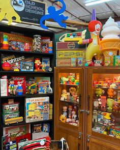 a display case filled with lots of toys and other items in a toy store or playroom