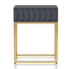 a black and gold side table with geometric design on the top, against a white background