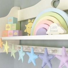 there is a shelf that has some little princess toys on it and other items in front of it