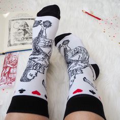 A pair of Alice in Wonderland socks featuring an iconic Alice illustration from artist John Tenniel These ladies socks are made from a super comfy brushed cotton with a classic black and white design. These bookish socks are a fun and practical gift for any occasion. made from: 70% combed cotton, 15% polyester, 10% spandex and 5% elastic. dimensions: Fits adult shoe size 3 - 7. Alice Illustration, Literature Gifts, Book Socks, Ladies Socks, John Tenniel, Womens Socks, Gift For Book Lover, Socks Gift, Novelty Socks