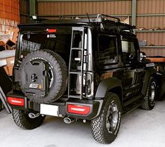 a black jeep parked in front of a building