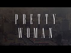 the words pretty woman are in front of a cityscape