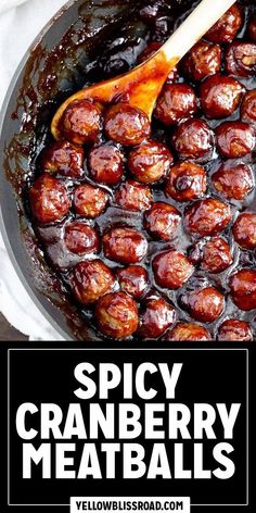 spicy cranberry meatballs in a skillet with a wooden spoon and text overlay