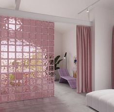 a living room with pink walls and curtains