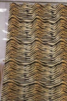 a tiger print shower curtain in a bathroom