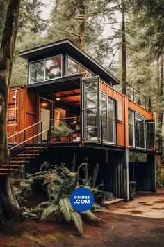 an orange shipping container house in the woods