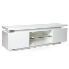 a white entertainment center with glass doors and drawers on the bottom, in front of a white background