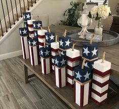 some patriotic bags are sitting on a table in front of the stairs and railings