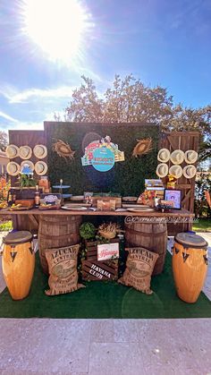 an outdoor display with wooden barrels and decorations