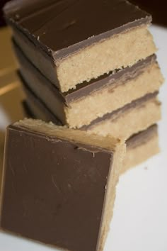 a stack of chocolate and peanut butter bars