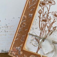 a close up of a card with flowers on it