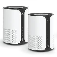 two white and black speakers sitting next to each other