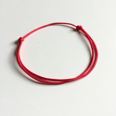 Lucky Bracelet Red String Red cord Good luck Bracelet Adult size: Length: approx 7 to 12.5 inches (adjustable) 1.5mm thread (thin cord) Baby Size: 1mm thin cord (adjustable) Length: approx 4.75 to 8 inches Perfect bracelet for new born / toddler / baby. Color: Red Feel free to contact me for any question!! *Color may slightly different due to the lighting!! Baby Color, Good Luck Bracelet, Lucky Bracelet, Red String, Baby Size, Simple Design, Good Luck, Simple Designs, Baby Toddler